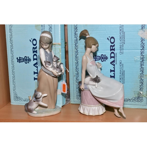 411 - TWO BOXED LLADRO FIGURES, 'Following Her Cats' No. 1309, designed by Juan Huerta, height 24.5cm and ... 