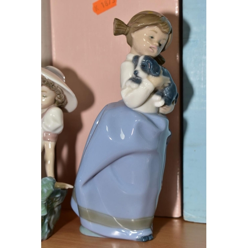 413 - FOUR NAO FIGURES, 'Girl with Puppy' No. 0241 (boxed), 'Pampered Poodle' No. 1157 (boxed) 'Girl With ... 