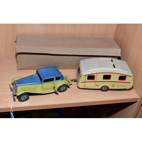 432 - A METTOY TINPLATE CLOCKWORK TWO DOOR SALOON CAR AND METTOY TINPLATE CARAVAN, car has cream body and ... 