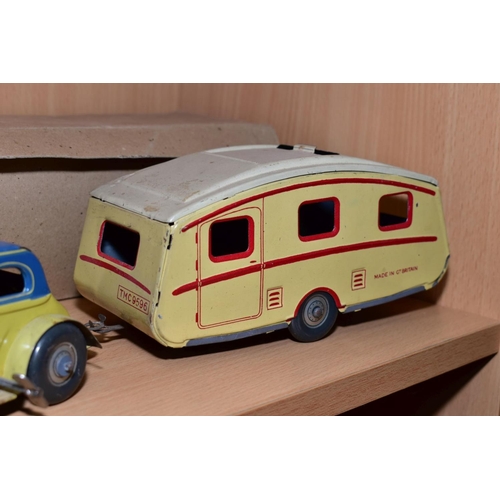 432 - A METTOY TINPLATE CLOCKWORK TWO DOOR SALOON CAR AND METTOY TINPLATE CARAVAN, car has cream body and ... 