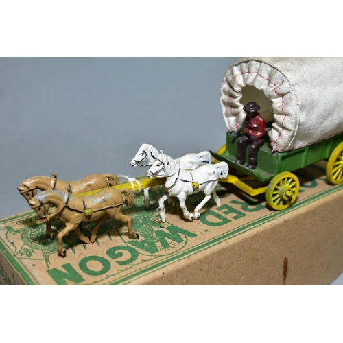 433 - A BOXED MODERN PRODUCTS COVERED WAGON WITH FOUR HORSES, green body, yellow wheels, plain canopy with... 