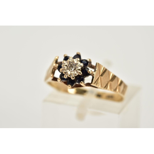 44 - A 9CT GOLD SAPPHIRE AND DIAMOND CLUSTER RING, designed with a central illusion set single cut diamon... 