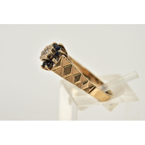 44 - A 9CT GOLD SAPPHIRE AND DIAMOND CLUSTER RING, designed with a central illusion set single cut diamon... 