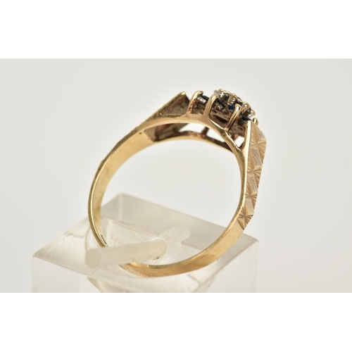 44 - A 9CT GOLD SAPPHIRE AND DIAMOND CLUSTER RING, designed with a central illusion set single cut diamon... 