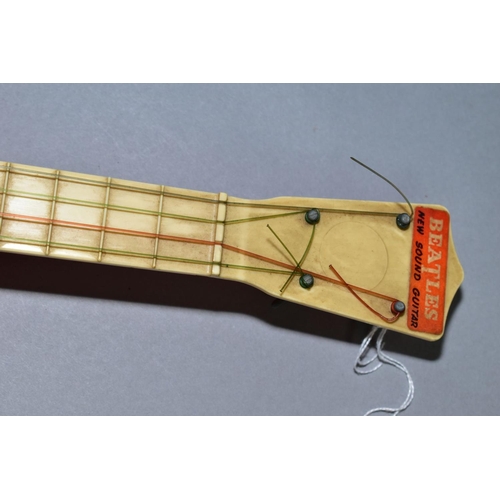 445 - A 1960'S SELCOL PRODUCTS LIMITED BEATLES 'NEW SOUND' GUITAR, with strings and pegs, marked 'Made in ... 