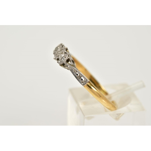 45 - AN EARLY 20TH CENTURY THREE STONE DIAMOND RING, set with a row of three illusion set single cut diam... 