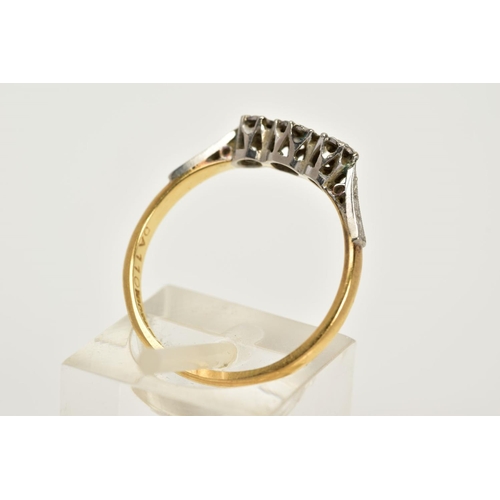 45 - AN EARLY 20TH CENTURY THREE STONE DIAMOND RING, set with a row of three illusion set single cut diam... 