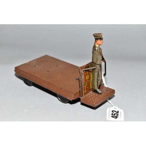 452 - A TIPP & CO TINPLATE CLOCKWORK STATION LUGGAGE TROLLEY, playworn condition, missing trunk, driver mi... 