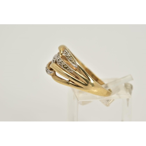 47 - A 9CT GOLD DIAMOND OPENWORK RING, designed with four interlocking openwork hoops, two hoops set with... 