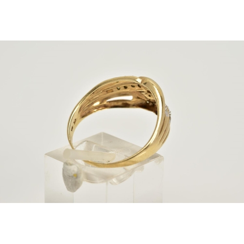 47 - A 9CT GOLD DIAMOND OPENWORK RING, designed with four interlocking openwork hoops, two hoops set with... 