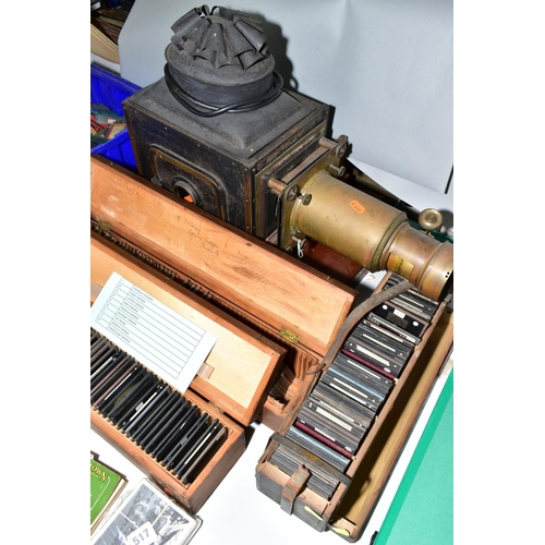 514 - A VICTORIAN TINPLATE AND BRASS MOUNTED MAGIC LANTERN, length 59cm(sd) together with three boxes of l... 