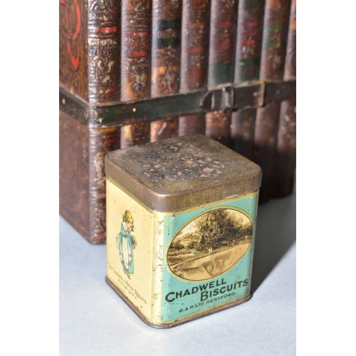 528 - A HUNTLEY & PALMERS BISCUIT TIN IN THE FORM OF A BUNDLE OF BOOKS, TIED WITH A STRAP, together with a... 