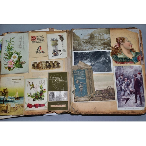 529 - AN EARLY 20TH CENTURY SCRAPBOOK, containing postcards, greetings cards and newspaper cuttings