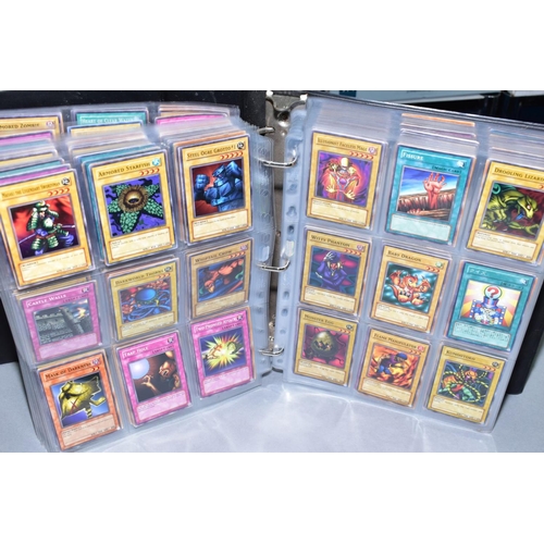 553 - A COLLECTION OF ASSORTED KONAMI YU-GI-OH TRADING CARDS, over one thousand cards from various series ... 