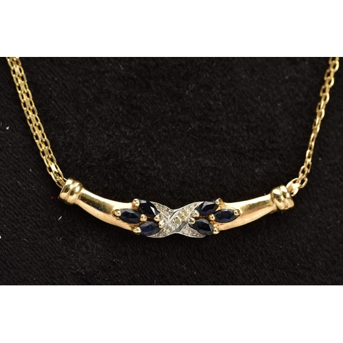 56 - A 9CT GOLD SAPPHIRE AND DIAMOND PENDANT NECKLACE, the fixed pendant panel designed with a central cr... 