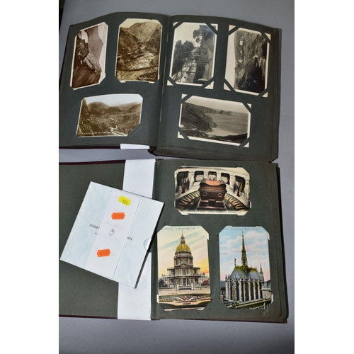 525 - TWO VINTAGE POSTCARD ALBUMS, one containing approximately  145 sepia photographic postcards of mostl... 