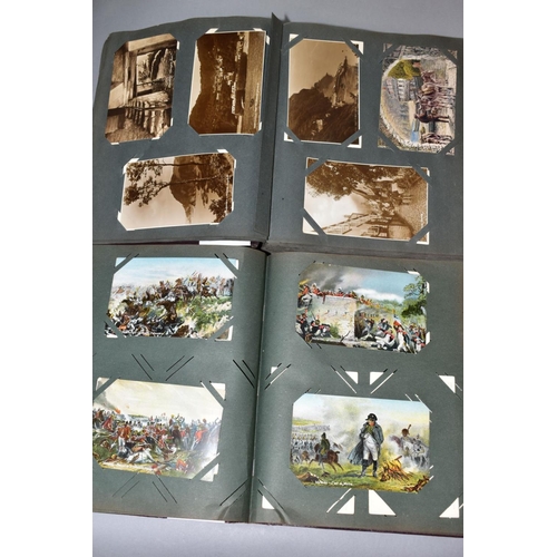 525 - TWO VINTAGE POSTCARD ALBUMS, one containing approximately  145 sepia photographic postcards of mostl... 