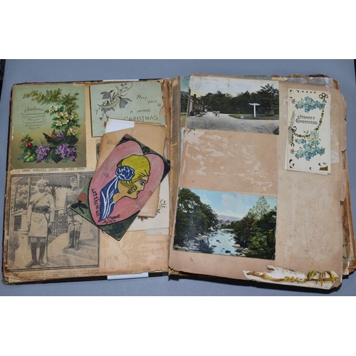 529 - AN EARLY 20TH CENTURY SCRAPBOOK, containing postcards, greetings cards and newspaper cuttings