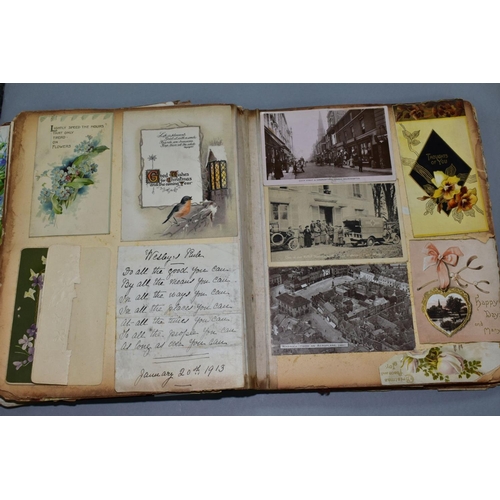 529 - AN EARLY 20TH CENTURY SCRAPBOOK, containing postcards, greetings cards and newspaper cuttings