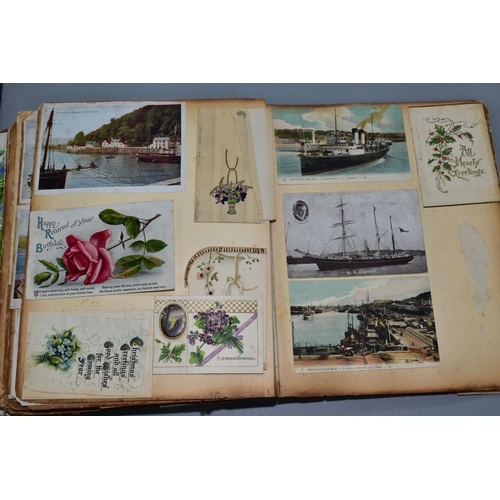 529 - AN EARLY 20TH CENTURY SCRAPBOOK, containing postcards, greetings cards and newspaper cuttings