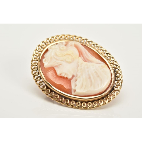 53 - A 9CT GOLD CAMEO BROOCH, of oval design, depicting a lady in profile, open work scallop surround, ha... 