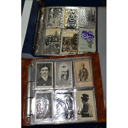 531 - POSTCARDS, two postcard albums containing approximately 230 Edwardian - early 20th century postcards... 