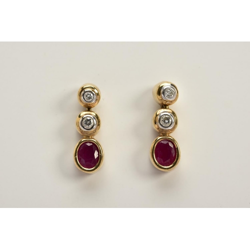 54 - A PAIR OF 9CT GOLD DIAMOND AND RUBY DROP EARRINGS, each designed with two round brilliant cut diamon... 