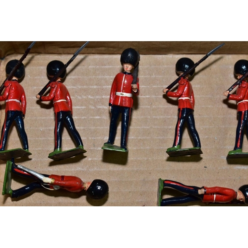 570 - A QUANTITY OF BRITAINS HOLLOWCAST GUARDSMAN, with a quantity of Britains  Scottish Infantry figures,... 