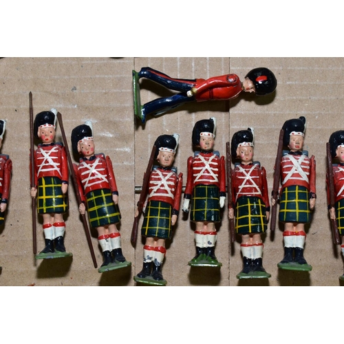 570 - A QUANTITY OF BRITAINS HOLLOWCAST GUARDSMAN, with a quantity of Britains  Scottish Infantry figures,... 