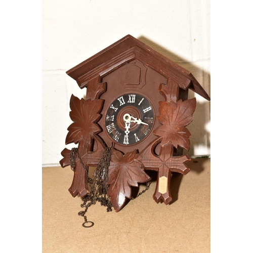 651 - FOUR CARVED WOODEN CUCKOO CLOCKS