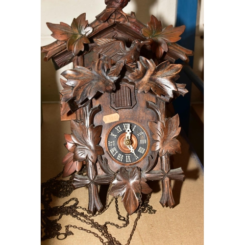 651 - FOUR CARVED WOODEN CUCKOO CLOCKS