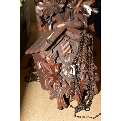 651 - FOUR CARVED WOODEN CUCKOO CLOCKS