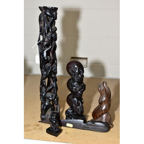 660 - NATIVE ART INTEREST, carved hardwood figure of a woman surrounded by men and women 46cm high, carved... 