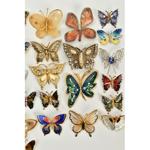 68 - A QUANTITY OF BUTTERFLY BROOCHES, to include yellow and white metal brooches of various designs such... 