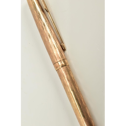 69 - A 9CT GOLD BALL POINT PARKER PEN, of engine turn design, hallmarked 9ct gold London, approximate wei... 