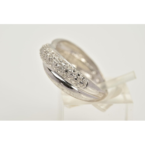 70 - A WHITE METAL DIAMOND RING, of crossover design, set with a row of single cut diamonds, plain polish... 