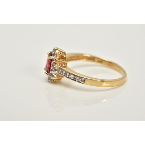 76 - A 9CT GOLD RUBY AND SAPPHIRE CLUSTER RING, designed with a central oval cut ruby within a circular c... 