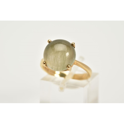 77 - A 9CT GOLD TOURMALATED QUARTZ RING, designed with a claw set cabochon, tapered shoulders, hallmarked... 