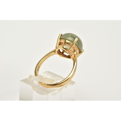 77 - A 9CT GOLD TOURMALATED QUARTZ RING, designed with a claw set cabochon, tapered shoulders, hallmarked... 