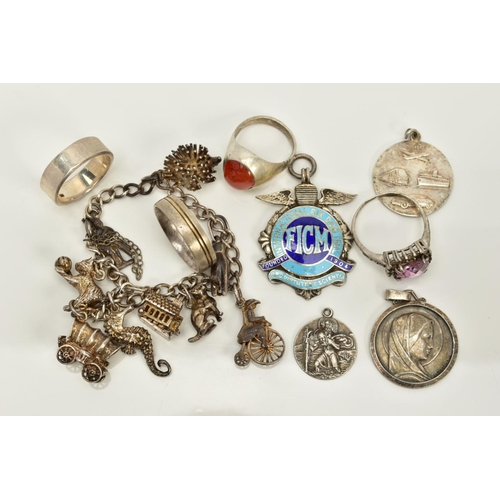 81 - A SELECTION OF JEWELLERY, to include a white metal charm bracelet, suspending nine charms such as a ... 