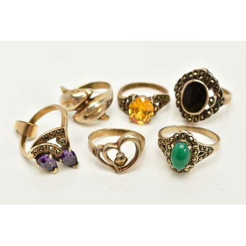 83 - A SELECTION OF SIX RINGS, to include an onyx and marcasite cluster ring, Sheffield import mark, ring... 