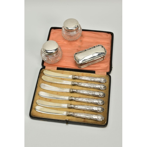 85 - A SELECTION OF SILVER JARS AND KNIVES, to include two small glass jars with silver foliate decorated... 