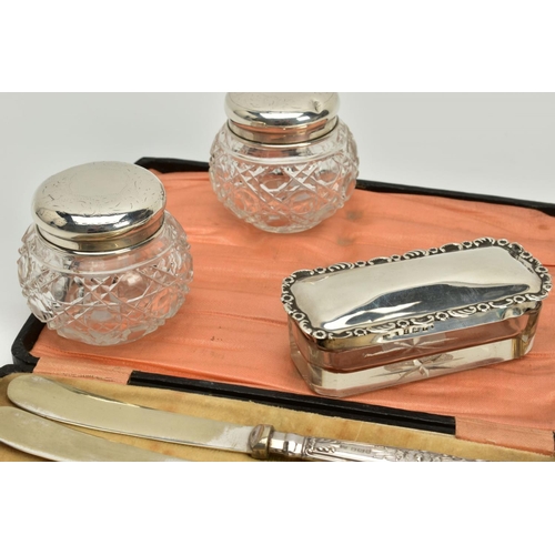 85 - A SELECTION OF SILVER JARS AND KNIVES, to include two small glass jars with silver foliate decorated... 