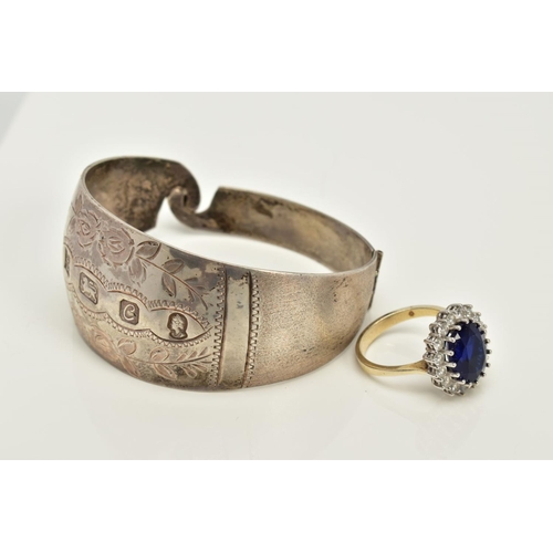 86 - A SILVER BANGLE AND RING, the silver hinged bangle with floral engraved detail, hallmarked Birmingha... 