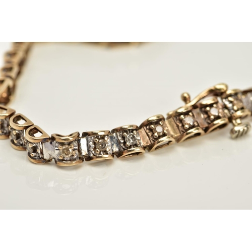 60 - A 9CT GOLD DIAMOND TENNIS BRACELET, designed with thirty-eight barrel shape links each set with a ti... 