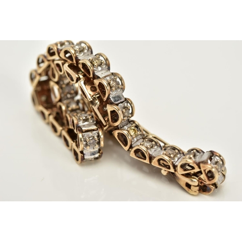 60 - A 9CT GOLD DIAMOND TENNIS BRACELET, designed with thirty-eight barrel shape links each set with a ti... 