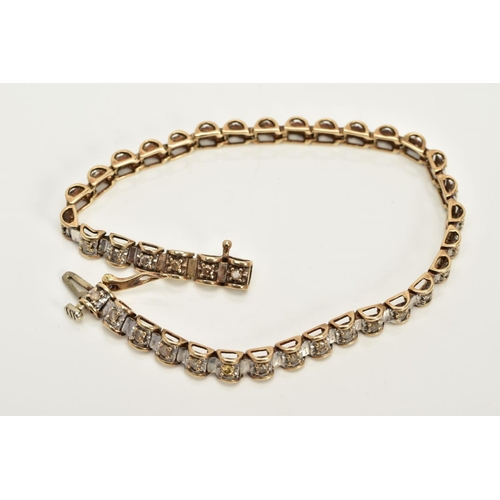 60 - A 9CT GOLD DIAMOND TENNIS BRACELET, designed with thirty-eight barrel shape links each set with a ti... 