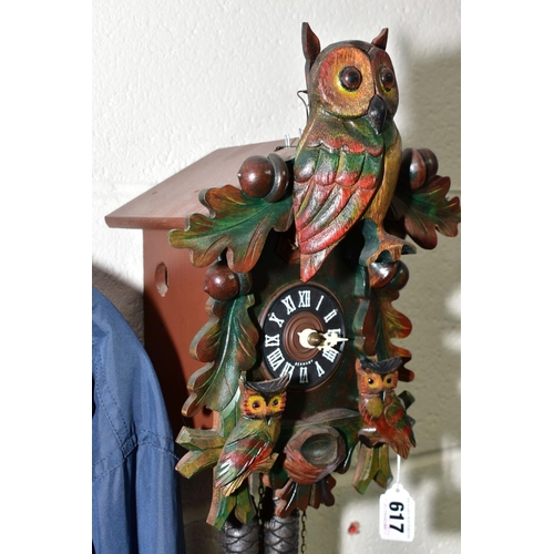 617 - A MID TWENTIETH CENTURY CUCKOO CLOCK with pendulum and weights, made in Germany height approximately... 