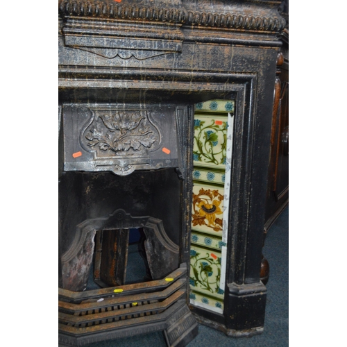 1359 - AN EARLY 20TH CENTURY CAST IRON FIRE INSERT, flanked with floral tile inserts, width 105cm x depth 3... 