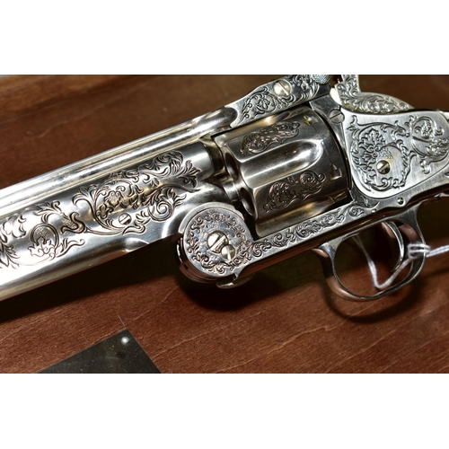 A BOXED FRANKLIN MINT WYATT EARP .44 REVOLVER, on a wooden display